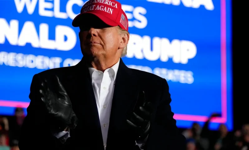Former President Donald Trump arrives at a rally, Saturday, March 12, 2022, in Florence, S.C. Trump has endorsed two Republicans mounting primary challenges to sitting House members who have been critical of him. (AP Photo/Meg Kinnard)