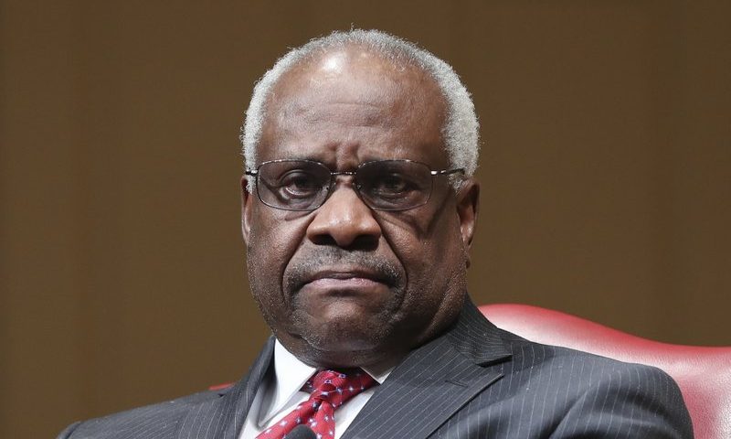 FILE - In this Feb. 15, 2018, file photo, Supreme Court Associate Justice Clarence Thomas sits as he is introduced during an event at the Library of Congress in Washington. Thomas is asking his first questions at Supreme Court arguments in more than three years. Arguments were almost over Wednesday in a case about racial discrimination in the South when the courtâ€™s only African-American member and lone Southerner piped up.(AP Photo/Pablo Martinez Monsivais, File)