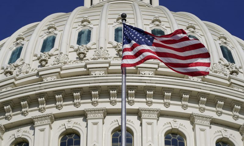 An American flag waves below the U.S. Capitol dome on Capitol Hill in Washington, Thursday, June 9, 2022. The House committee investigating the Jan. 6 insurrection at the U.S. Capitol will hold the first in a series of hearings laying out its findings on Thursday night. (AP Photo/Patrick Semansky)