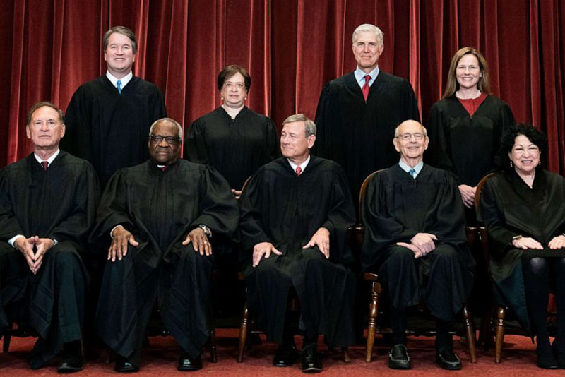 Erin Schaff/Pool via AP Members of the Supreme Court pose for a group photo at the Supreme Court in Washington, D.C., April 23, 2021. Seated from left, Associate Justice Samuel Alito, Associate Justice Clarence Thomas, Chief Justice John Roberts, Associate Justice Stephen Breyer and Associate Justice Sonia Sotomayor. Standing from left, Associate Justice Brett Kavanaugh, Associate Justice Elena Kagan, Associate Justice Neil Gorsuch and Associate Justice Amy Coney Barrett.