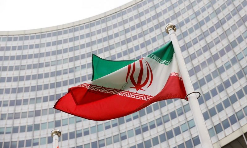 FILE PHOTO: The Iranian flag waves in front of the International Atomic Energy Agency (IAEA) headquarters, amid the coronavirus disease (COVID-19) pandemic, in Vienna, Austria May 23, 2021. REUTERS/Leonhard Foeger/File Photo