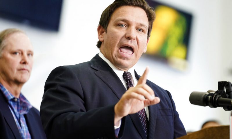FILE - Florida Gov. Ron DeSantis speaks to supporters and members of the media after a bill signing on Nov. 18, 2021, in Brandon, Fla. In Florida, for the first time in modern history, there are more registered Republican voters than Democrats. Republican Gov. Ron DeSantis is heading into a reelection campaign buoyed by a national profile and a cash reserve unmatched by any of his Democratic challengers. And Republicans control virtually all of state government. (AP Photo/Chris O'Meara, File)
