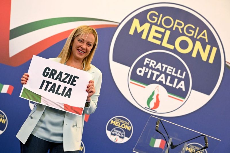 Leader of Italian far-right party "Fratelli d'Italia" (Brothers of Italy), Giorgia Meloni holds a placard reading "Thank You Italy" after she delivered an address at her party's campaign headquarters overnight on September 26, 2022 in Rome, after the country voted in a legislative election. - Far-right leader Giorgia Meloni won big in Italian elections on September 25, the first projections suggested, putting her eurosceptic populists on course to take power at the heart of Europe. (Photo by Andreas SOLARO / AFP) (Photo by ANDREAS SOLARO/AFP via Getty Images)