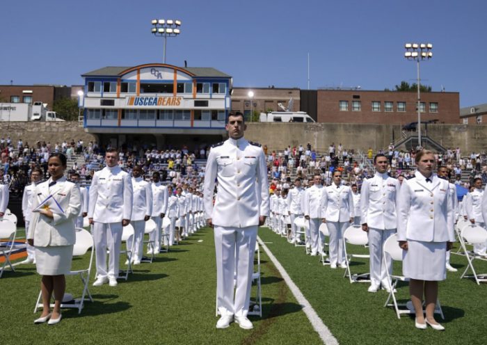 Cadets stand as President Joe Biden arrives to speak at the United States Coast Guard Academy commencement in New London, Conn., on May 19, 2021. (Andrew Harnik/AP)