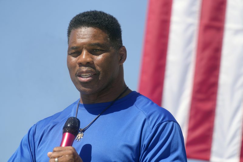 Georgia GOP Senate nominee Herschel Walker makes remarks during a campaign stop at Battle Lumber Co. on Thursday, Oct. 6, 2022, in Wadley, Ga. Walker's appearance was his first following reports that a woman who said Walker paid for her 2009 abortion is actually mother of one of his children - undercutting Walker's claims he didn't know who she was. (AP Photo/Meg Kinnard)