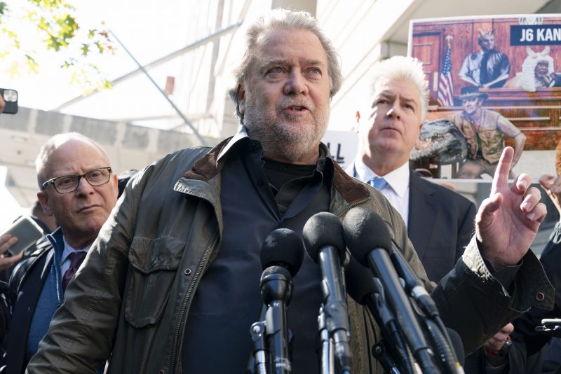 Steve Bannon, center, a longtime ally of former President Donald Trump and convicted of contempt of Congress, accompanied by his attorneys David Schoen, left, and Evan Corcoran, right, speaks to the media as he leaves the federal courthouse on Friday, Oct. 21, 2022, in Washington. Bannon was sentenced to 4 months behind bars for defying a Jan. 6 committee subpoena. ( AP Photo/Jose Luis Magana)