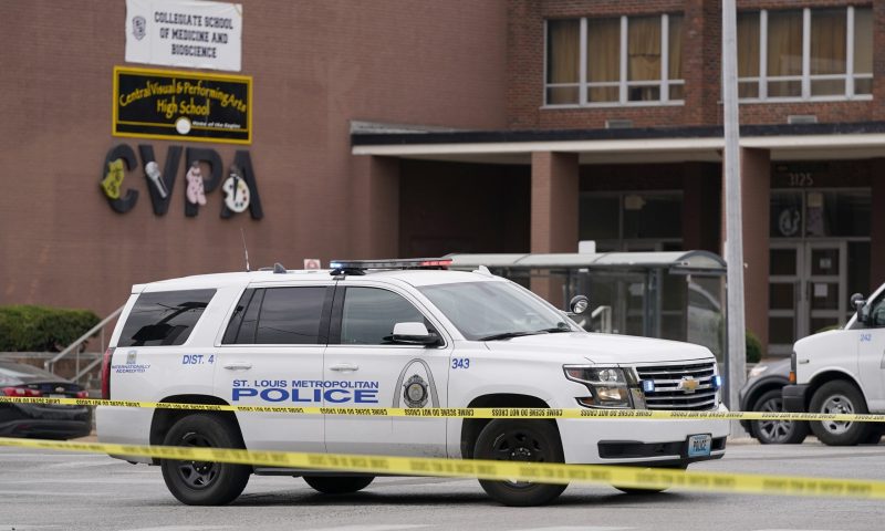 Law enforcement investigate the scene of a shooting at Central Visual and Performing Arts High School Monday, Oct. 24, 2022, in St. Louis. (AP Photo/Jeff Roberson)
