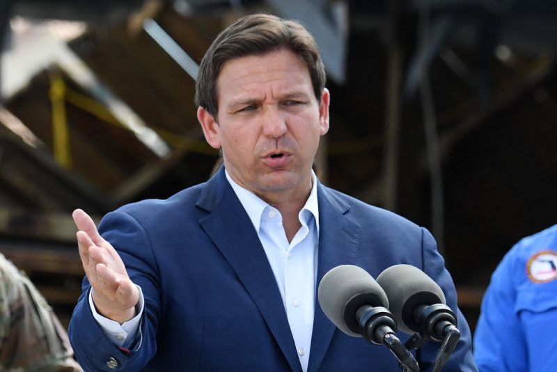 Florida Governor Ron DeSantis speaks in a neighborhood impacted by Hurricane Ian at Fisherman's Wharf in Fort Myers, Florida, on October 5, 2022 as US President Joe Biden visits the area. (Photo by OLIVIER DOULIERY / AFP) (Photo by OLIVIER DOULIERY/AFP via Getty Images)