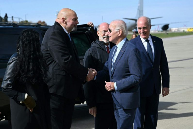 US President Joe Biden is greeted by Pennsylvania Lt. Gov. and Democratic senatorial candidate John Fetterman upon arrival at Pittsburgh International Airport in Pittsburgh, Pennsylvania, on October 20, 2022. (Photo by MANDEL NGAN / AFP) (Photo by MANDEL NGAN/AFP via Getty Images)