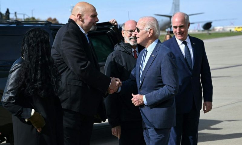 US President Joe Biden is greeted by Pennsylvania Lt. Gov. and Democratic senatorial candidate John Fetterman upon arrival at Pittsburgh International Airport in Pittsburgh, Pennsylvania, on October 20, 2022. (Photo by MANDEL NGAN / AFP) (Photo by MANDEL NGAN/AFP via Getty Images)