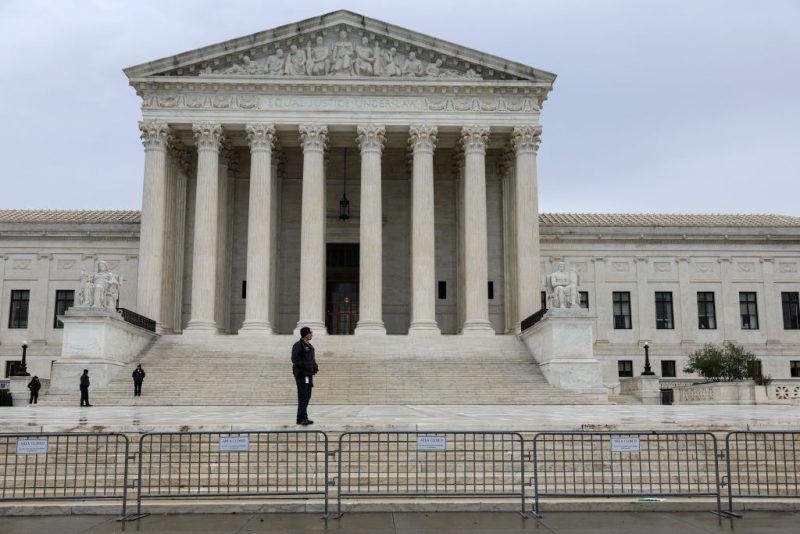 WASHINGTON, DC - OCTOBER 03: A law enforcement official stands in front of the U.S. Supreme Court Building on October 03, 2022 in Washington, DC. The Court is hearing oral arguments for their first set of cases today which are Sackett v. Environmental Protection Agency and Delaware v. Pennsylvania and Wisconsin. (Photo by Anna Moneymaker/Getty Images)