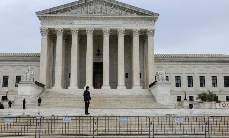 WASHINGTON, DC - OCTOBER 03: A law enforcement official stands in front of the U.S. Supreme Court Building on October 03, 2022 in Washington, DC. The Court is hearing oral arguments for their first set of cases today which are Sackett v. Environmental Protection Agency and Delaware v. Pennsylvania and Wisconsin. (Photo by Anna Moneymaker/Getty Images)