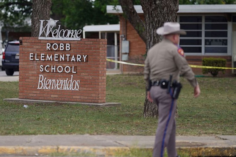 An officer walks outside of Robb Elementary School in Uvalde, Texas, May 24, 2022. Allison Dinner/AFP via Getty Images