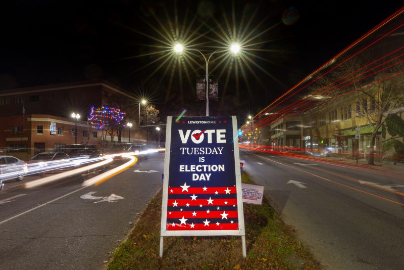 A sign reminds residents to do their civic duty on Election Day, Tuesday, Nov. 8, 2022, in Lewiston, Maine. (AP Photo/Robert F. Bukaty)