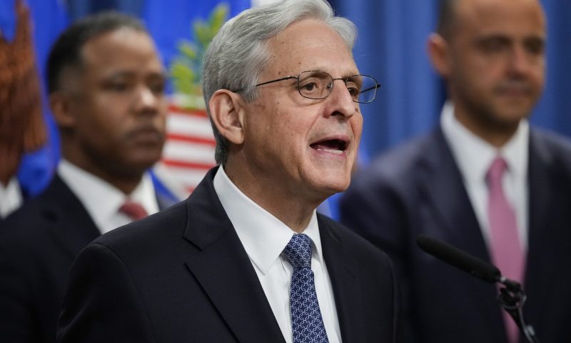 Assistant Attorney General for the Criminal Division Kenneth Polite and U.S. Attorney for the District of Columbia Matthew Graves, right, listen, as Attorney General Merrick Garland announces Jack Smith as special counsel to oversee the Justice Department's investigation into the presence of classified documents at former President Donald Trump's Florida estate and aspects of a separate probe involving the Jan. 6 insurrection and efforts to undo the 2020 election, at the Justice Department in Washington, Friday, Nov. 18, 2022. (AP Photo/Andrew Harnik)