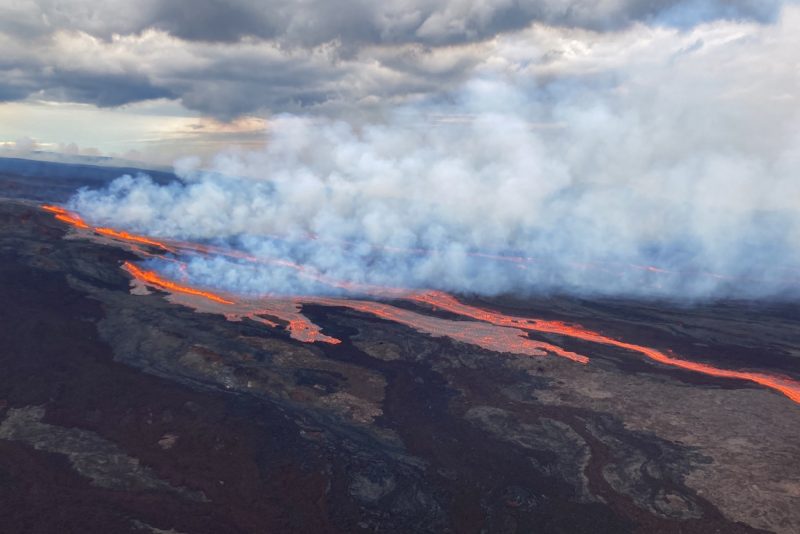 In this aerial photo released by the U.S. Geological Survey, the Mauna Loa volcano is seen erupting from vents on the Northeast Rift Zone on the Big Island of Hawaii, Monday, Nov. 28, 2022. Hawaii's Mauna Loa, the world's largest active volcano, began spewing ash and debris from its summit, prompting civil defense officials to warn residents on Monday to prepare in case the eruption causes lava to flow toward communities. (U.S. Geological Survey via AP)