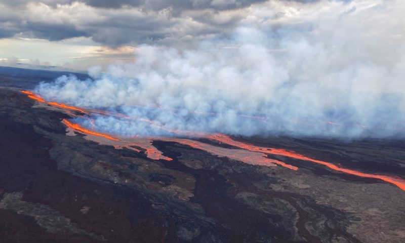 In this aerial photo released by the U.S. Geological Survey, the Mauna Loa volcano is seen erupting from vents on the Northeast Rift Zone on the Big Island of Hawaii, Monday, Nov. 28, 2022. Hawaii's Mauna Loa, the world's largest active volcano, began spewing ash and debris from its summit, prompting civil defense officials to warn residents on Monday to prepare in case the eruption causes lava to flow toward communities. (U.S. Geological Survey via AP)