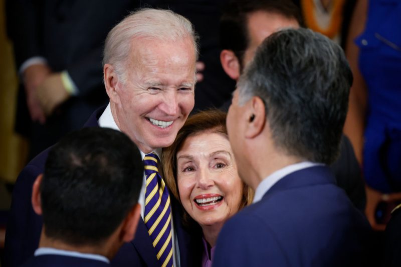 WASHINGTON, DC - AUGUST 10: (L-R) U.S. President Joe Biden gathers with Speaker of the House Nancy Pelosi (D-CA) and Rep. Mark Takano (D-CA) after signing The PACT Act in the East Room of the White House August 10, 2022 in Washington, DC. The bill is the biggest expansion of veteran's benefits since the Agent Orange Act of 1991 and will expand health care benefits to millions of veterans exposed to toxic substances during their military service. (Photo by Chip Somodevilla/Getty Images)
