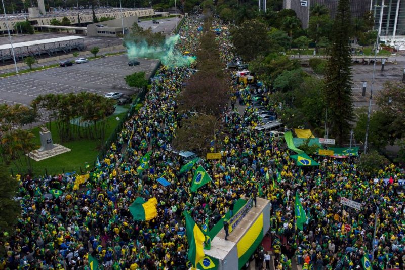Aerial view of supporters of Brazilian President Jair Bolsonaro taking part in a protest to ask for federal intervention outside Brazil's Armed Forces Headquarters in Sao Paulo, Brazil, on November 2, 2022. - Thousands of Bolsonaristas gathered this Wednesday in front of Army commands in the main cities of Brazil to ask for a military intervention in the face of the victory of leftist Lula da Silva at the polls. (Photo by Miguel SCHINCARIOL / AFP) (Photo by MIGUEL SCHINCARIOL/AFP via Getty Images)