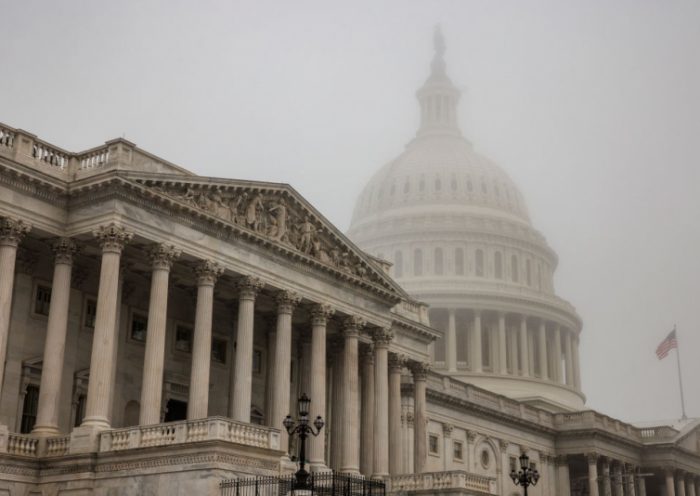 WASHINGTON, DC - NOVEMBER 04: Early morning fog envelopes the U.S. Capitol dome behind the U.S. House of Representatives on November 4, 2022 in Washington, DC. Republicans are poised to regain control of the U.S. Congress in the midterm elections on November 8 after the Democrats gained the majority in both the House in 2018 and Senate in 2020. (Photo by Samuel Corum/Getty Images)