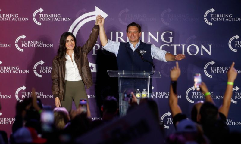 CLEARWATER, FL - NOVEMBER 05: Florida Gov. Ron DeSantis and Anna Paulina Luna are greeted by supporters during a campaign speech during the Unite & Win Rally at the OCC Roadhouse & Museum on November 5, 2022 in Clearwater, Florida. DeSantis continues campaigning against Democratic gubernatorial candidate Charlie Crist ahead of the midterm elections on November 8th. (Photo by Octavio Jones/Getty Images)