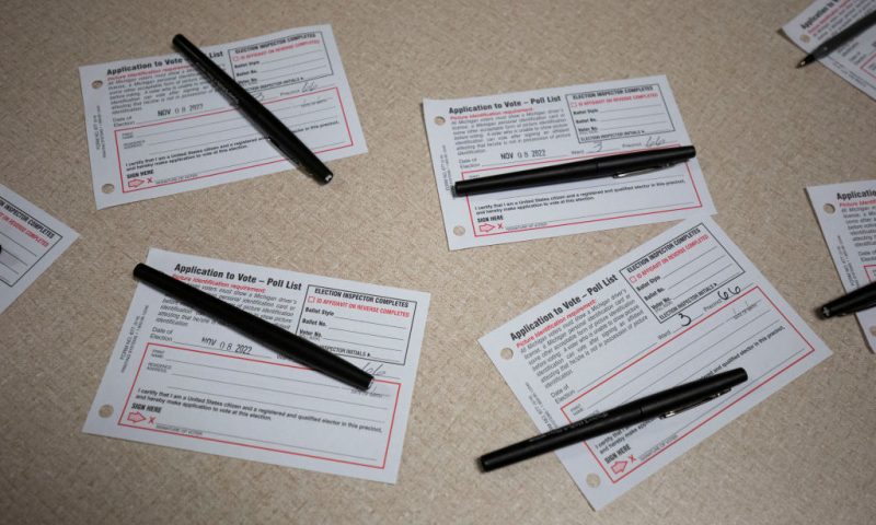 GRAND RAPIDS, MI - NOVEMBER 08: Applications to vote sit on a table at a polling location on election day on November 8, 2022 in Grand Rapids, Michigan. After months of candidates campaigning, Americans are voting in the midterm elections to decide close races across the nation. (Photo by Bill Pugliano/Getty Images)