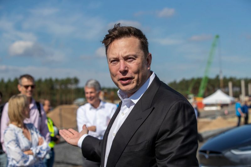 GRUENHEIDE, GERMANY - SEPTEMBER 03: Tesla head Elon Musk talks to the press as he arrives to to have a look at the construction site of the new Tesla Gigafactory near Berlin on September 03, 2020 near Gruenheide, Germany. Musk is currently in Germany where he met with vaccine maker CureVac on Tuesday, with which Tesla has a cooperation to build devices for producing RNA vaccines, as well as German Economy Minister Peter Altmaier yesterday. (Photo by Maja Hitij/Getty Images)
