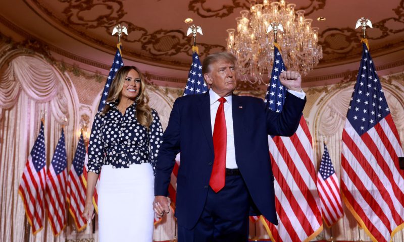 Former U.S. President Donald Trump and former first lady Melania Trump stand together during an event at his Mar-a-Lago home on November 15, 2022 in Palm Beach, Florida. Trump announced that he was seeking another term in office and officially launched his 2024 presidential campaign. (Photo by Joe Raedle/Getty Images)