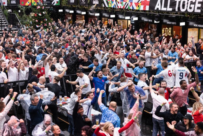 England fans cheer at BOXPARK Croydon as they watch a live broadcast of England's opening group-round match versus Iran on November 21, 2022 in London, England. The quadrennial FIFA World Cup Qatar 2022 tournament is taking place in Qatar through December 18. (Photo by Dan Kitwood/Getty Images)