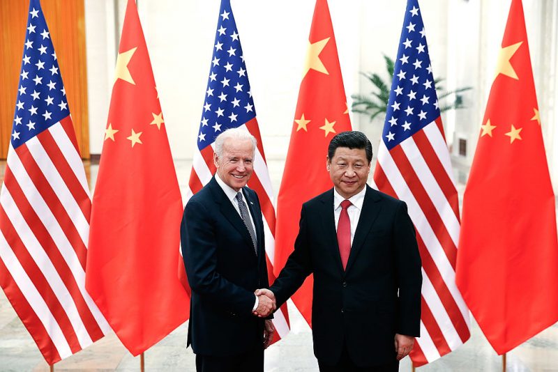 Chinese President Xi Jinping (R) shake hands with U.S Vice President Joe Biden (L) inside the Great Hall of the People on December 4, 2013 in Beijing, China. (Photo by Lintao Zhang/Getty Images)