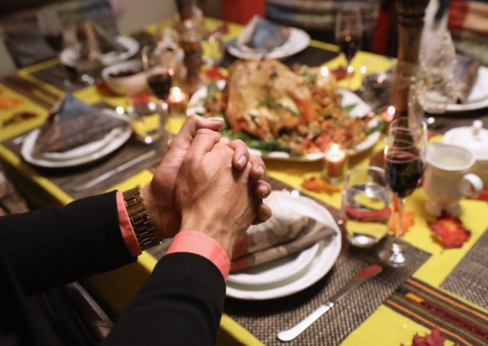 STAMFORD, CT - NOVEMBER 24: Central American immigrants and their families pray before Thanksgiving dinner on November 24, 2016 in Stamford, Connecticut. Family and friends, some of them U.S. citizens, others on work visas and some undocumented immigrants came together in an apartment to celebrate the American holiday with turkey and Latin American dishes. They expressed concern with the results of the U.S. Presidential election of president-elect Donald Trump, some saying their U.S.-born children fear the possibilty their parents will be deported after Trump's inauguration. (Photo by John Moore/Getty Images)