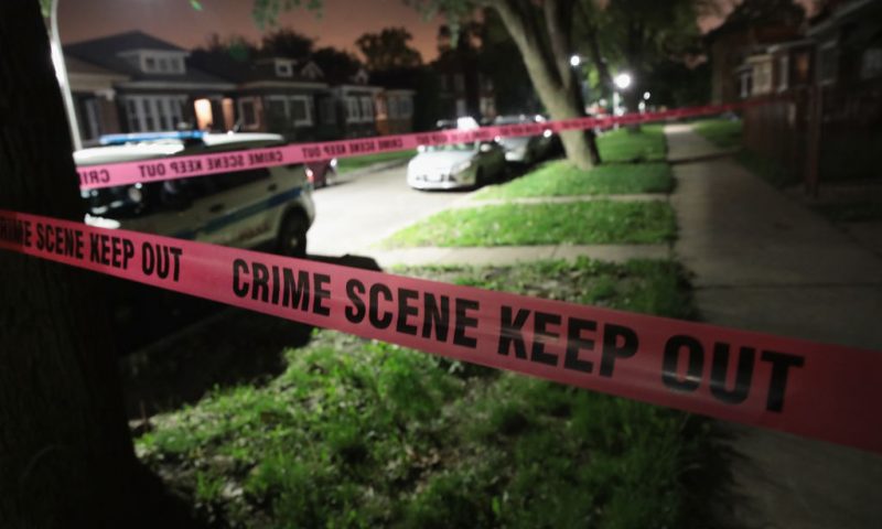 Crime scene tape is stretched around the front of a home where a man was shot on May 28, 2017 in Chicago, Illinois. Chicago police have added more than 1,000 officers to the streets over the Memorial Day weekend, hoping to put a dent in crime, during what is typically one of the more violent weekends of the year. In 2016, 6 people were killed and another 65 were wounded by gun violence over the Memorial Day weekend. (Photo by Scott Olson/Getty Images)
