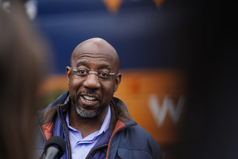 U.S. Sen. Raphael Warnock, D-Ga., who is running for reelection against Republican candidate Herschel Walker in a runoff election, speaks during an election day canvass launch on Tuesday, Dec. 6, 2022, in Norcross, Ga. (AP Photo/Brynn Anderson)