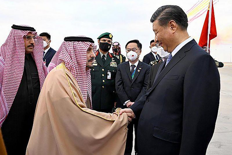 Chinese President Xi Jinping, right, shakes hands with Prince Faisal bin Bandar bin Abdulaziz, Governor of Riyadh, after his arrival in Riyadh, Saudi Arabia, Wednesday, Dec. 7, 2022. (Saudi Press Agency via AP)