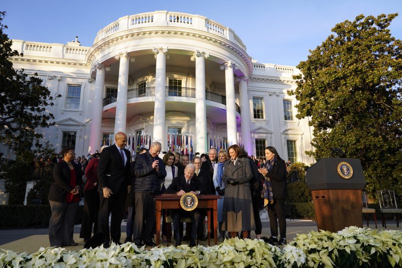 President Joe Biden signs the Respect for Marriage Act, Tuesday, Dec. 13, 2022, on the South Lawn of the White House in Washington. (AP Photo/Patrick Semansky)