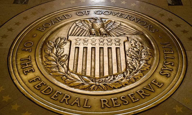 FILE- In this Feb. 5, 2018, file photo, the seal of the Board of Governors of the United States Federal Reserve System is displayed in the ground at the Marriner S. Eccles Federal Reserve Board Building in Washington. The Federal Reserve reinforced its inflation fight Wednesday, Dec. 14, 2022, by raising its key interest rate for the seventh time this year and signaling more hikes to come. But the Fed announced a smaller hike than it had in its past four meetings at a time when inflation is showing signs of easing. (AP Photo/Andrew Harnik, File)