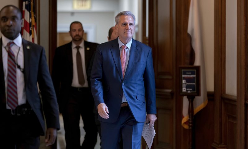 House Minority Leader Kevin McCarthy, R-Calif., who is hoping to become the next speaker of the House in the new Republican majority, walks to the chamber as lawmakers debate a massive $1.7 trillion spending bill that finances federal agencies and provides aid to Ukraine, at the Capitol in Washington, Friday, Dec. 23, 2022. (AP Photo/J. Scott Applewhite)