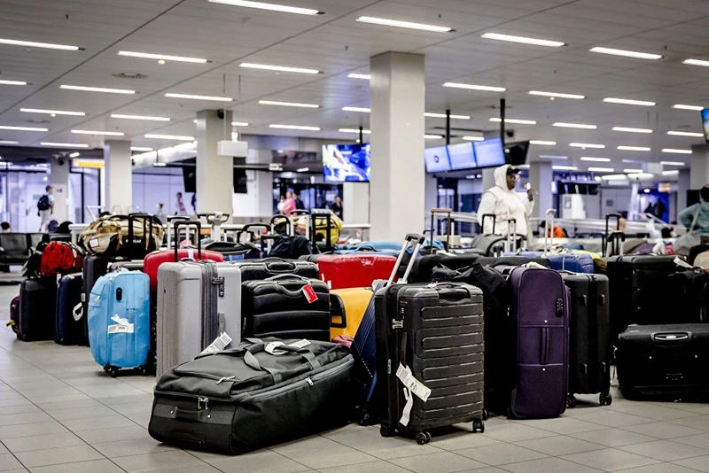 This photograph taken on July 26, 2022 shows suitcases at the baggage claim service at Schiphol Airport in Amsterdam. - Due to staff shortages, crowds and many missed flights, thousands of suitcases are waiting at the baggage claim service. (Photo by Remko de Waal / ANP / AFP) / Netherlands OUT (Photo by REMKO DE WAAL/ANP/AFP via Getty Images)