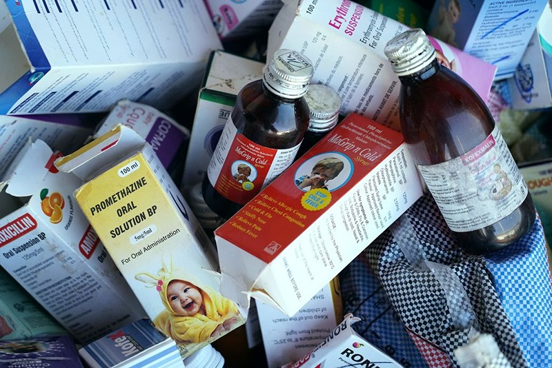 A photograph shows collected cough syrups in Banjul on October 06, 2022. - Indian authorities are investigating cough syrups made by a local pharmaceutical company after the World Health Organisation said they could be responsible for the deaths of 66 children in The Gambia. (Photo by MILAN BERCKMANS / AFP) (Photo by MILAN BERCKMANS/AFP via Getty Images)