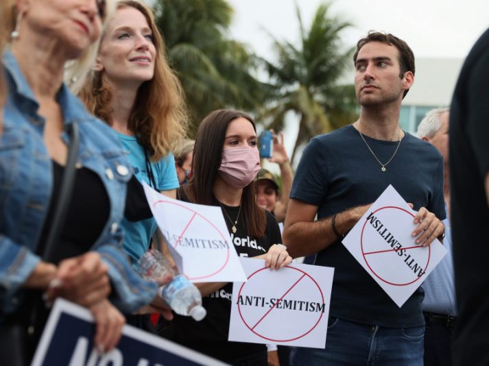 MIAMI BEACH, FLORIDA - JUNE 03: People stand together during an interfaith Rally Against Anti-Semitism, hosted by Greater Miami Jewish Federation at the Holocaust Memorial Miami Beach on June 03, 2021 in Miami Beach, Florida. The rally was held as crimes against the Jewish community have risen in recent weeks. (Photo by Joe Raedle/Getty Images)