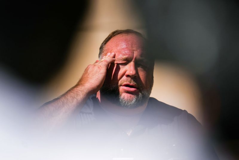 InfoWars founder Alex Jones speaks to the media outside Waterbury Superior Court during his trial on September 21, 2022 in Waterbury, Connecticut. Jones is being sued by several victims' families for causing emotional and psychological harm after they lost their children in the Sandy Hook massacre. A Texas jury last month ordered Jones to pay $49.3 million to the parents of 6-year-old Jesse Lewis, one of 26 students and teachers killed in the shooting in Newtown, Connecticut. (Photo by Joe Buglewicz/Getty Images)