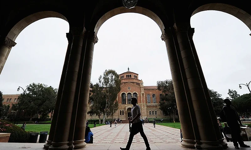 LOS ANGELES, CA - APRIL 23: A student walks near Royce Hall on the campus of UCLA on April 23, 2012 in Los Angeles, California. According to reports, half of recent college graduates with bachelor's degrees are finding themselves underemployed or jobless. (Photo by Kevork Djansezian/Getty Images)