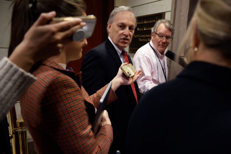 WASHINGTON, DC - NOVEMBER 15: Rep. Andy Biggs (R-AZ) (C) talks briefly with reporters as he heads into House Republican caucus leadership elections in the U.S. Capitol Visitors Center on November 15, 2022 in Washington, DC. A supporter of former President Donald Trump's lie about the 2020 election, Biggs is challenging House Minority Leader Kevin McCarthy (R-CA) for leader of the caucus. (Photo by Chip Somodevilla/Getty Images)