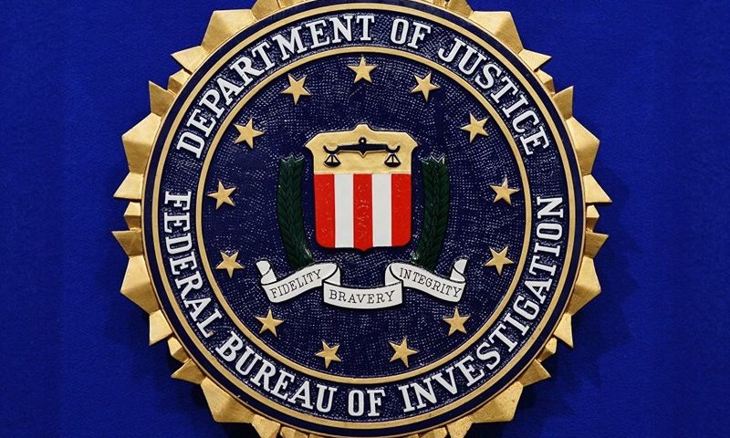 The Federal Bureau of Investigation (FBI) seal is seen on the lectern following a press conference announcing the FBI's 499th and 500th additions to the "Ten Most Wanted Fugitives" list on June 17, 2013 at the Newseum in Washington, DC. AFP PHOTO/Mandel NGAN (Photo by Mandel NGAN / AFP) (Photo by MANDEL NGAN/AFP via Getty Images)