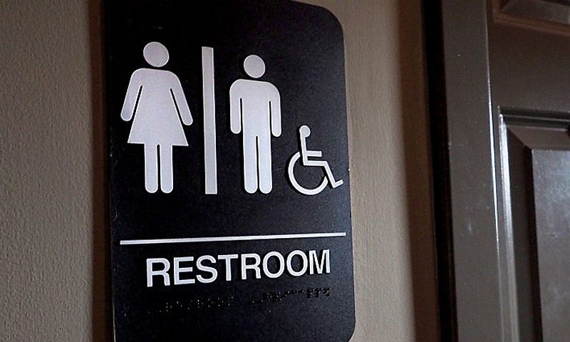 DURHAM, NC - MAY 10: A unisex sign and the "We Are Not This" slogan are outside a bathroom at Bull McCabes Irish Pub on May 10, 2016 in Durham, North Carolina. Debate over transgender bathroom access spreads nationwide as the U.S. Department of Justice countersues North Carolina Governor Pat McCrory from enforcing the provisions of House Bill 2 that dictate what bathrooms transgender individuals can use. (Photo by Sara D. Davis/Getty Images)
