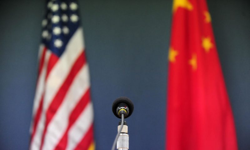 The US and China flags stand behind a microphone awaiting the arrival of US Senator John McCain, who was joined by Senators Lindsey Graham Amy Klobuchar for a press conference at the US Embassy in Beijing on April 9, 2009 during the China stop of the Congressional Delegation's fact-finding Asia-tour. Senator McCain said he urged Chinese officials in talks here to back a strong United Nations response to North Korea's rocket launch, but indicated China had resisted. AFP PHOTO/Frederic J. BROWN (Photo credit should read FREDERIC J. BROWN/AFP via Getty Images)