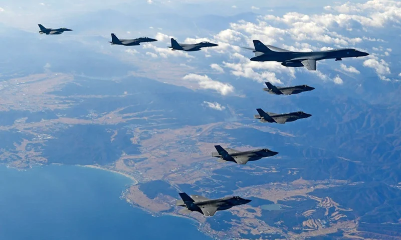 In this handout image provided by South Korean Defense Ministry, U.S. Air Force B-1B bomber (L), South Korea and U.S. fighter jets fly over the Korean Peninsula during the Vigilant air combat exercise (ACE) on December 6, 2017 in Korean Peninsula, South Korea. The largest-scale warplanes and military personnel take part in the annual joint exercise, which was scheduled before the North's latest missile test. North Korea fired a new intercontinental ballistic missile (ICBM) on November 29, believed to have shown capability to reach to the U.S. mainland. (Photo by South Korean Defense Ministry via Getty Images)