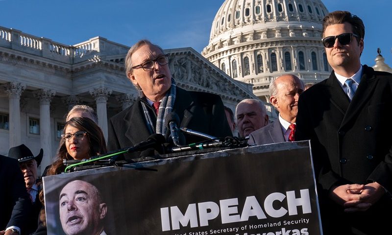 Rep. Andy Biggs, R-Ariz., a member of the conservative House Freedom Caucus, speaks with a group of Republican lawmakers calling for the impeachment Secretary of Homeland Security Alejandro Mayorkas because of illegal immigrants crossing the border from Mexico, Tuesday, Dec. 13, 2022, outside the Capitol in Washington. He is joined in the front row by, from left, Rep. Lauren Boebert, R-Colo., and Rep. Matt Gaetz, R-Fla. Biggs has also stated he will try to thwart House Republican Leader Kevin McCarthy, D-Calif., from becoming speaker of the House. (AP Photo/J. Scott Applewhite)