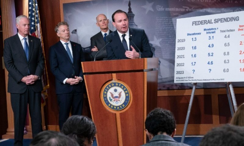A group of Republican senators, from left, Sen. Ron Johnson, R-Wis., Sen. Rand Paul, R-Ky., Sen. Rick Scott, R-Fla., and Sen. Mike Lee, R-Utah, criticize Democratic spending and the current process to fund the government, during a news conference at the Capitol in Washington, Wednesday, Dec. 14, 2022. (AP Photo/J. Scott Applewhite)