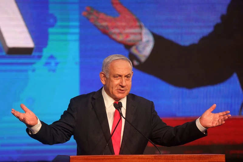 Israeli Prime Minister Benjamin Netanyahu, leader of the Likud party, addresses supporters at the party campaign headquarters in Jerusalem early on March 24, 2021, after the end of voting in the fourth national election in two years. (Photo by EMMANUEL DUNAND / AFP) (Photo by EMMANUEL DUNAND/AFP via Getty Images)